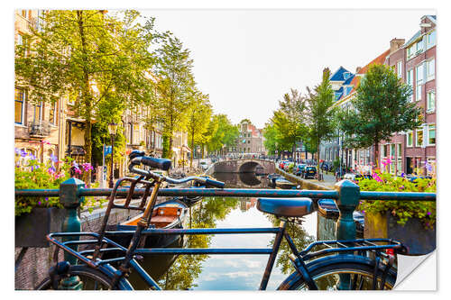 Selvklebende plakat Bicycle on a canal in Amsterdam