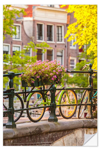 Selvklebende plakat Bicycles on a sunny canal bridge in Amsterdam