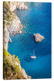 Canvas print Sailing boat in blue bay on Capri