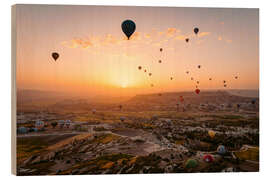 Puutaulu Hot air balloon flight during sunrise over Cappadocia