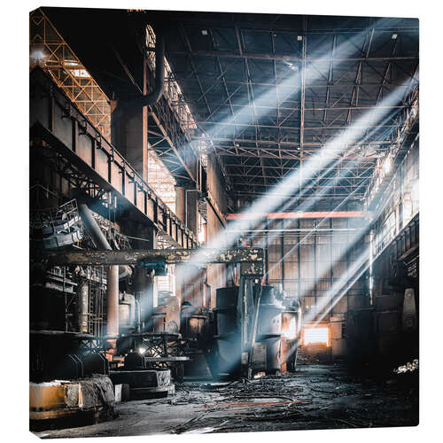 Canvas print Rays of light inside an abandoned steel mill