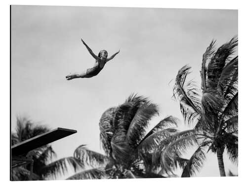 Aluminiumsbilde Young girl diving with palm trees