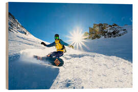 Wood print Snowboarder with splitboard rides in the snow