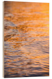 Hout print Sunset reflects in the ocean