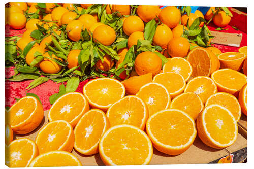 Canvas print Oranges in a market