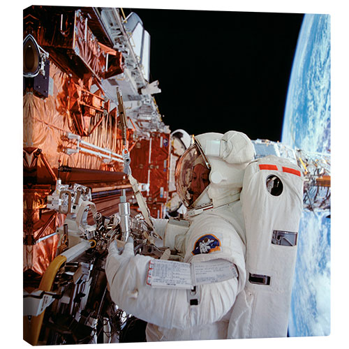 Canvas print EVA Astronaut servicing the Hubble Space Telescope