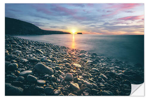 Wall sticker Stone beach by the sea at sunrise