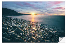 Selvklebende plakat Stone beach by the sea at sunrise