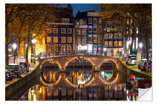 Selvklebende plakat Illuminated bridge at night in Amsterdam, the Netherlands