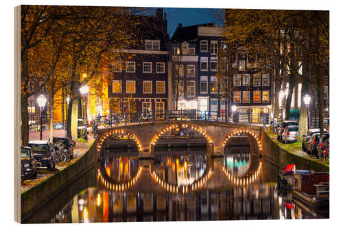 Stampa su legno Illuminated bridge at night in Amsterdam, the Netherlands