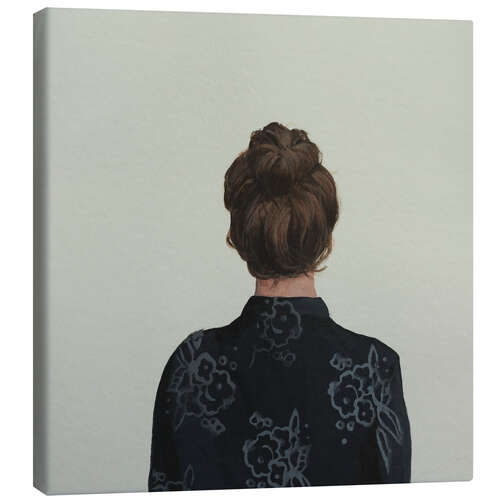 Canvas-taulu Back view of a woman with a bun and a patterned blouse