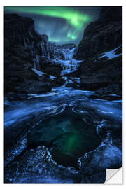 Muursticker Aurora night over a frozen waterfall in Iceland