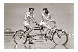Poster Young couple riding a tandem bike on the beach, 1940s
