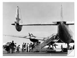 Naklejka na ścianę Passengers of a triple tail constellation style aircraft, 1950s