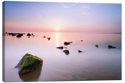 Tableau sur toile Enjoying the peace and quiet by the sea with a setting sun