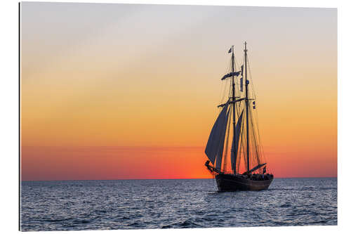 Galleriataulu Sailing ship at sunset on the Baltic Sea