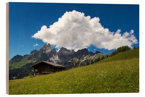 Wood print Alpine meadow with mountain hut and cloud formation in summer