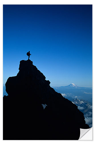 Selvklæbende plakat Climber on Top of a Rock Pinnacle in Mount Rainer National Park