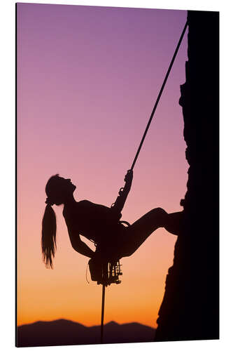 Stampa su alluminio Woman Climbing at Sunset Over Salt Lake Valley in the Wasatch Mountains