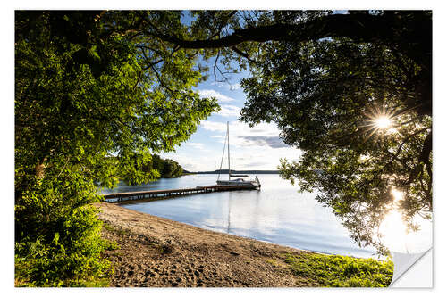 Autocolante decorativo Sailboat on a lake at sunset