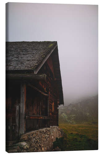 Leinwandbild Almhütte im Nebel