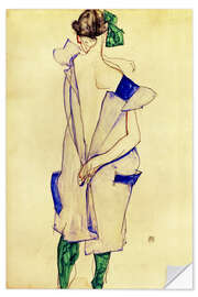 Muursticker Standing girl in blue dress and green stockings, back view, 1913