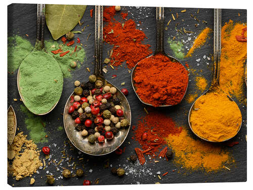 Canvas print Colorful spices on antique spoons