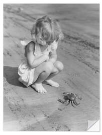 Sticker mural Little Girl Watching a Crab on the Beach