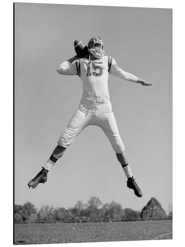 Aluminium print Quarterback Jumping and Throwing Football