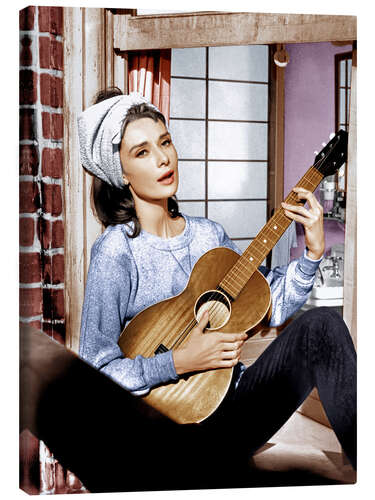 Tableau sur toile Audrey Hepburn plays the guitar in "Breakfast at Tiffany's"