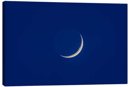 Canvas print Waxing moon with earthshine in twilight