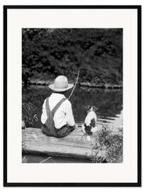 Framed art print Farm boy with straw hat fishing with his dog