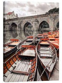 Canvas print Boats moored on river bank