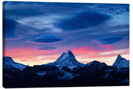 Canvas print Lenticular clouds during sunrise behind Schreckhorn