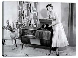Canvas print Woman posing with record player, 1955