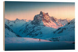 Wood print Ski tourer with Patteriol in the background at sunset - Lucas Tiefenthaler