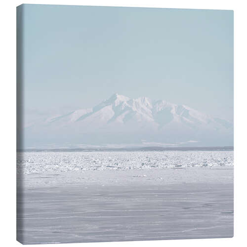 Canvas print Snow-covered mountain in Japan in front of a sea of ice