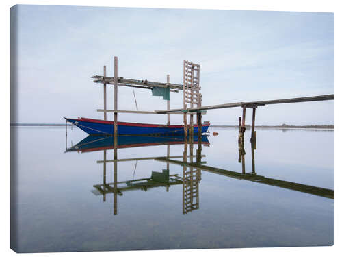 Obraz na płótnie Fishing boat at the jetty on a lake, Italy
