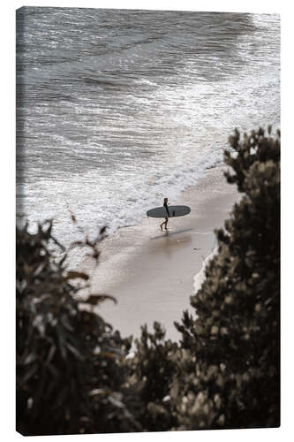 Canvas print Surfer with surfboard at the beach