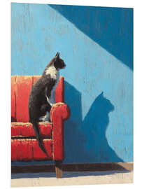 Hartschaumbild Katze sitzt auf einem roten Sofa