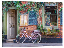 Leinwandbild Gemütliches Café mit rosa Fahrrad - Assaf Frank