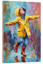 Holzbild Glücklicher Junge tanzt im Regen