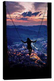 Leinwandbild Silhouette einer Frau auf einer Schaukel